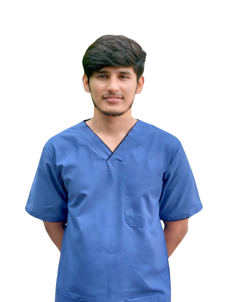 Dr Jawwad Ahmad smiling in a Blue Scrub.